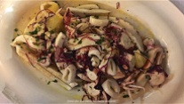 Salad of squid, calamari, octopus, crispy vegetables, vinegar, mild mustard, grapefruit, extra virgin olive oil